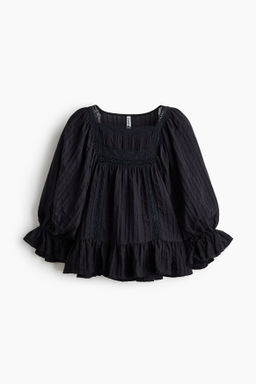 Blusa con mangas abullonadas