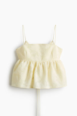 Top en tejido jacquard con peplum