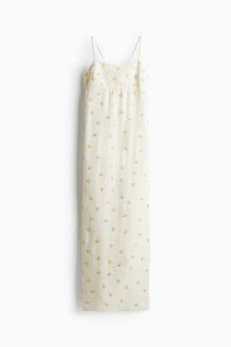 Vestido de tirantes con detalles decorativos
