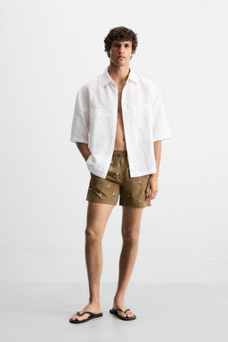 EMBROIDERED MID-LENGTH SWIMMING TRUNKS
