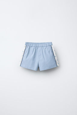 FLORAL TECHNICAL BERMUDA SHORTS