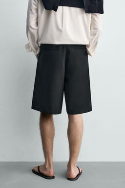 BERMUDA FLUIDA PLIEGUES / Negro