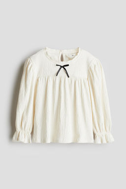 Blusa con ribete de picot