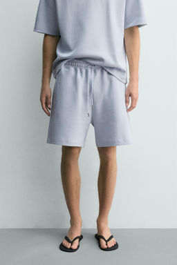 BERMUDA JOGGER RELAXED FIT INTERLOCK / Celeste