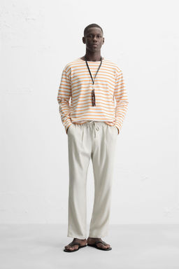RELAXED FIT FLOWING TROUSERS