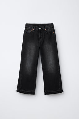 JEANS FLARE DESFLECADO / Negro