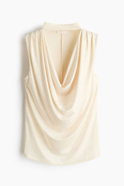 Top drapeado con cuello alto