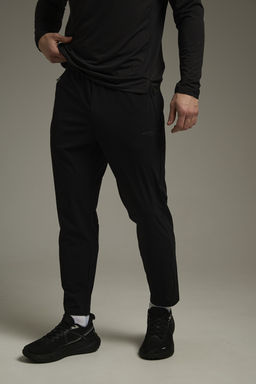 Брюки трикотажные укороченные Черный ADVANCED RUNNING Knit Ankle Pants - Anta фото 2