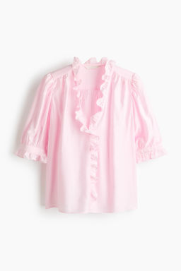 Blusa de volantes con mangas abullonadas