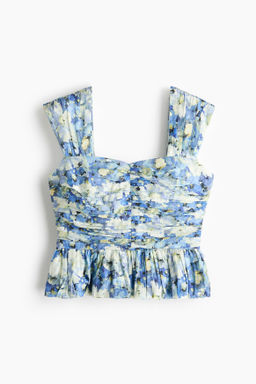 Top fruncido con peplum