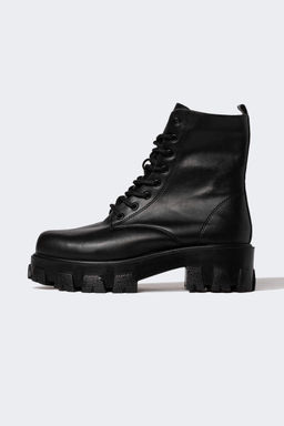 Женские ботинки из искусственной кожи на высокой подошве со шнуровкой и молнией