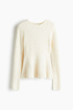 Top de peplum con cuentas decorativas