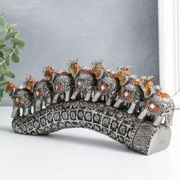 Фигурка полистоун «Семь слонов на бивне с цветами», серебро, 21×4×9.8 см