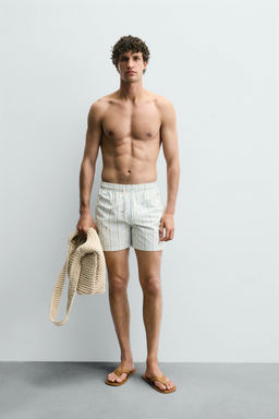 EMBROIDERED MID-LENGTH SWIMMING TRUNKS