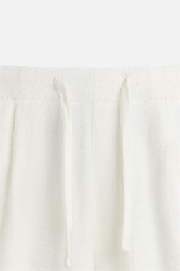 RELAXED FIT TEXTURED TROUSERS - Zara фото 7