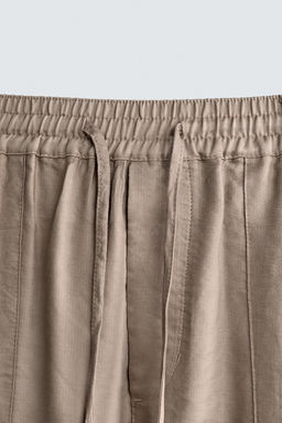 PANTAL?N FLUIDO RELAXED FIT / rosa claro