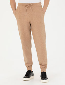 Бежевые зауженные трикотажные брюки с высоким воротником - Cacharel фото 2