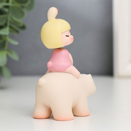 Сувенир полистоун "Малышка на медведе" пружинка 8х3х5,5 см