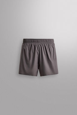 PANTALONES CORTOS LIGEROS RUNNING 3" / Morado
