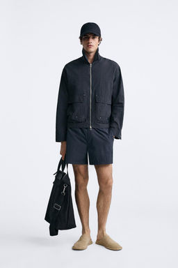 TECHNICAL JACKET WITH POCKETS