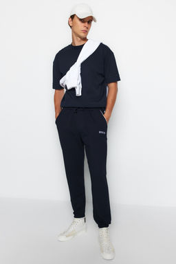 Lacivert Regular Fit Bask?l? Biyeli Lastik Paca Esofman Alt? TMNSS22EA0121