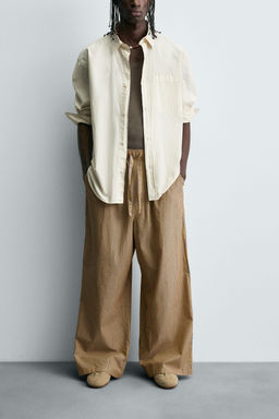 STRIPED OVERSIZE FIT TROUSERS