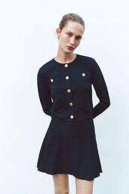 BOX PLEAT KNIT MINI SKIRT