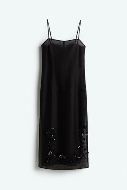 Vestido transparente con detalles decorativos