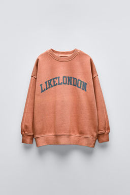 CRACKED EFFECT SLOGAN SWEATSHIRT