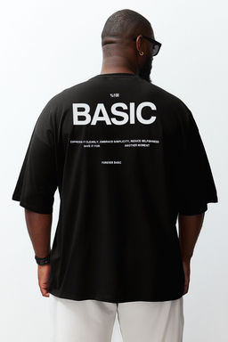 TRENDYOL MAN Siyah Oversize/Genis Kesim Bisiklet Yaka S?rt Bask?l? Buyuk Beden T-Shirt TMNSS25BF00004