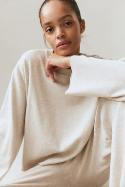 Jersey oversize con bajo redondeado