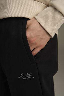Брюки трикотажные утепленные Черный ANTA TRN Knit Track Pants фото 10