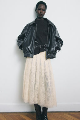 WOOL SLEEVELESS JUMPER WITH SIDE PLEATS