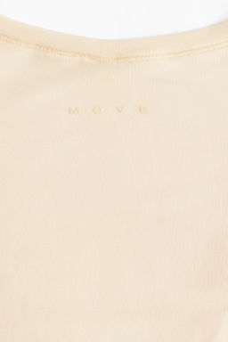 Top de deporte cruzado en modal - H&m фото 12