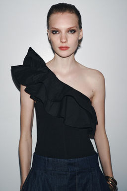 ASYMMETRIC CONTRAST RUFFLE BODYSUIT