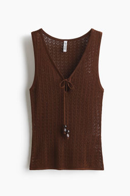 Top en punto pointelle con lazada
