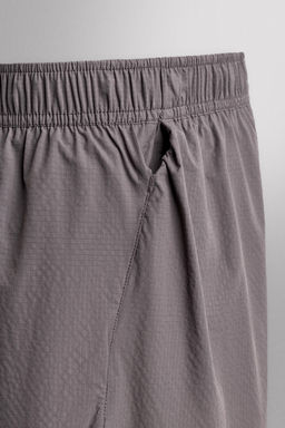 PANTALONES CORTOS LIGEROS RUNNING 3" / Morado