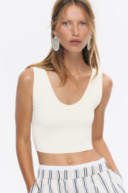 Top cropped sin mangas en punto fino - H&m фото 7