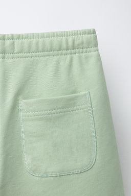 BERMUDA JOGGING TEXTO / Verde agua