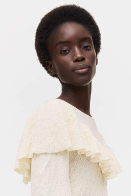 Top en punto texturizado con volantes - H&m фото 3