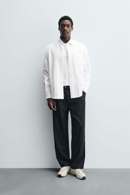 RELAXED FIT PLEATED TROUSERS