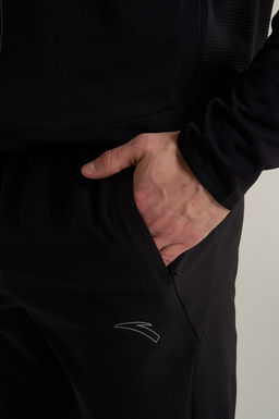 Брюки текстильные утепленные Черный ANTA RUNNING Woven Track Pants фото 8