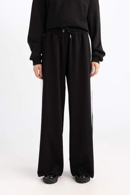 Стильные широкие спортивные штаны с широкими штанинами, эластичным поясом и полосками - Defacto фото 4