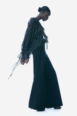 Blusa brillante de plumeti