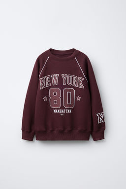 RAGLAN SLEEVE SLOGAN AND NUMBER SWEATSHIRT