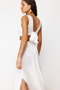 TRENDYOLMILLA Siyah Dokuma Puskullu Cut Out/Pencere Maxi Plaj Elbisesi TBESS21EL3624 фото 14