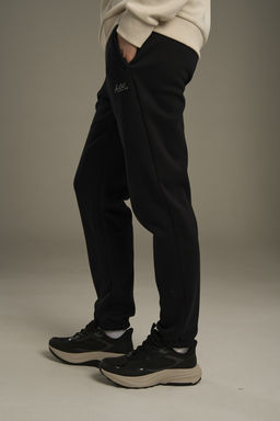 Брюки трикотажные утепленные Черный ANTA TRN Knit Track Pants фото 5