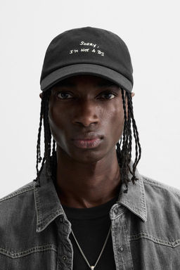 CAP WITH EMBROIDERED SLOGAN
