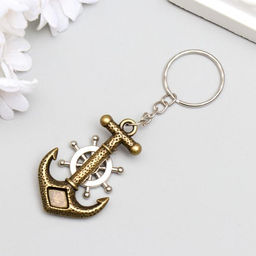 Цена за 12 шт. Брелок металл "Якорь и штурвал" 4,3х2,8 см