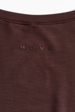 Top de deporte cruzado en modal - H&m фото 17